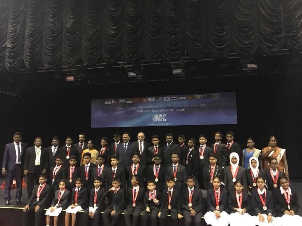 IMC 2018 students with flag